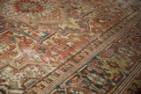 Vintage distressed Heriz carpet detail, geometric vinery, terra cotta, slate blue, foundation wear.
