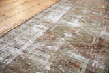 Distressed geometric pattern with exposed foundation threads, dusty red and moss green hues.