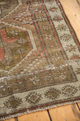 Distressed geometric patterns, worn pile, and visible foundation on this Caucasian rug.