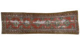 Antique Northwest Persian runner, brick red field, interconnected teal hexagonal medallions, visible wear.