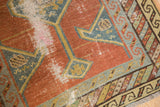 Antique Northwest Persian runner, worn brick red field, visible foundation, teal geometric borders.