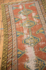 Antique Northwest Persian runner, localized hard wear on brick red, teal, saffron geometric motifs.