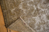 Distressed vintage Malayer rug showing worn pile, exposed foundation weave, visible knot heads, and fringe.