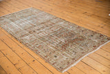 Distressed Mahal runner with faded charcoal, dusty teal, terra cotta floral designs and low pile.