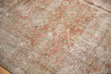 Distressed Mahal carpet detail showing even wear to foundation, dusty blush and beige floral.