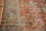 Distressed Mahal carpet detail, worn red pile, visible foundation, faded floral bouquets.