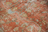 Worn texture of distressed Mahal carpet, with floral vinery in soft red and blue.