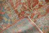 Distressed Vintage Mahal carpet, worn red and blue pile, visible woven foundation.