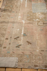 Plain beige textile patchwork on distressed vintage Oushak runner, reinforcing a worn area.