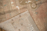 Hand-knotted vintage Oushak runner, showing distressed pile, exposed foundation, and reinforced edge.