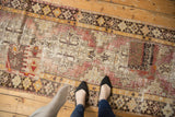 Distressed pile with integrated kilim patch, showing wear and geometric design.