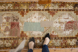 Vintage distressed Oushak runner with varied kilim patchwork and visible worn foundation.