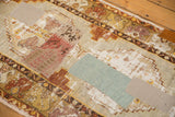 Varied fabric and kilim patchwork detail on a distressed vintage Oushak runner.