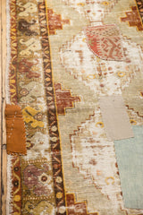 Vintage distressed Oushak runner with decorative multi-color fragment patchwork and worn texture.