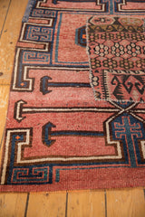 Distressed Kars rug detail: geometric patterns, blush, navy tones, kilim patchwork.