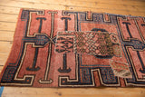 Distressed Kars rug with visible hand-stitched fragmented flatwoven kilim patchwork patterns.