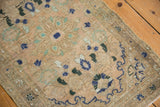 Distressed texture with faint foundation on Hamadan rug, displaying muted beige, navy, mint patterns.