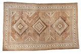Vintage Distressed Oushak carpet, geometric medallions, earthy beige and brown abrashes, low pile.