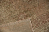 Distressed Oushak carpet pile with muted blush tones and woven hand-knotted backing.