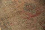 Distressed vintage Oushak carpet pile showing even wear, soft abrashes, and faint geometric patterns.