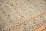 Distressed vintage Sparta carpet, worn ocean green and beige lattice pattern detail.