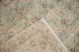 Distressed vintage Sparta carpet pile with ocean green lattice leaves and hand-knotted foundation.