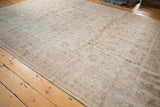 Distressed Turkish Sparta carpet, showing allover muted floral vinery and even worn texture.
