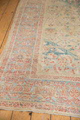 Distressed antique Sultanabad rug with sky blue samovar border and terra cotta Herati motifs.