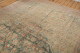 Faded allover Herati pattern in mallard green and terra cotta on the distressed Sultanabad carpet.