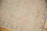 Even pile wear and distressed texture on a vintage Oushak rug, faded blush and beige.