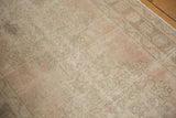 Distressed Oushak rug runner with even wear, showing pale blush and antique ivory pile.