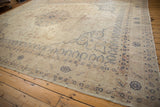 Low, distressed pile on the corner of a vintage Sparta carpet with navy blue border patterns.