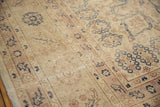 A detailed view of the distressed texture and visible knot heads of a vintage Sparta carpet.