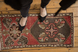 Distressed Oushak runner, dusty blush and chocolate brown asymmetric medallion with low pile.