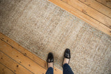 Distressed Sparta runner, allover scrolling vinery in muted ivory and pale coffee brown.