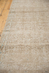 Distressed Sparta runner detail: even wear to knot heads, faded ivory-brown pattern.