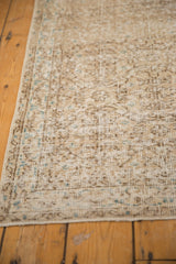 Vintage Distressed Sparta runner with even wear, faded ivory, brown, and pale blue vinery.