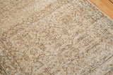 Distressed texture and even wear of a Sparta runner with faded vinery and subtle blue.