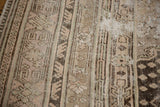 Distressed Khotan rug texture: pale rose, beige, oxidized silver stripes with clear foundation wear.