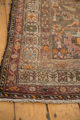 Antique Northwest Persian runner's intricate floral border, time-softened pile, and secure fringe.