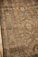 Antique Northwest Persian runner's intricate field blossoms and border, showing mostly even pile wear.