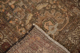 Antique Northwest Persian runner corner shows intricate floral field, hand-knotted foundation, and fringe.