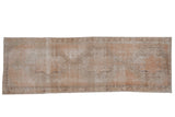 Vintage distressed Oushak runner, soft apricot, ivory, and charcoal with faded medallions. 3'4