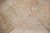 Distressed Oushak rug runner pile with visible knot heads and woven foundation revealed.