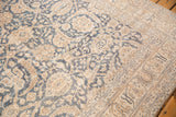Distressed vintage Sparta carpet with worn denim blue and beige floral vinery.