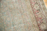Vintage Distressed Tabriz carpet: aqua green field, classic turtle samovar border, visible foundation.