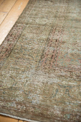 Distressed vintage Tabriz carpet showing subtle allover motif and foundation showing through.