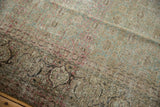Worn classic turtle samovar border and intricate motifs on a distressed vintage Tabriz rug.