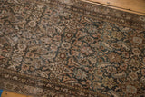 Distressed Malayer runner detail: Herati motif with even wear, charcoal, dusty rose, ivory tones.