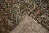 Distressed charcoal, dusty rose, blue Herati motif and hand-knotted foundation.